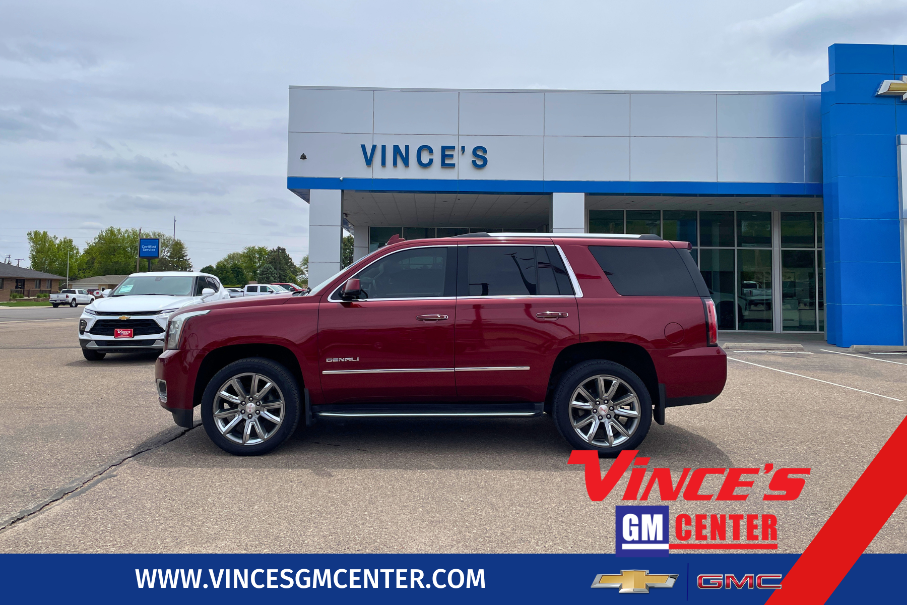 2016 GMC Yukon Denali in Crimson Red Tintcoat — front three-quarter view