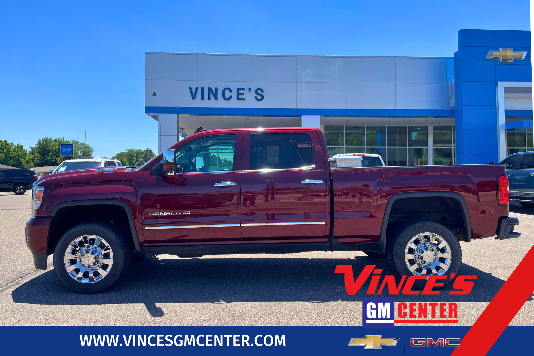 2017 GMC Sierra 2500 HD Denali in Deep Garnet Metallic — front three-quarter view